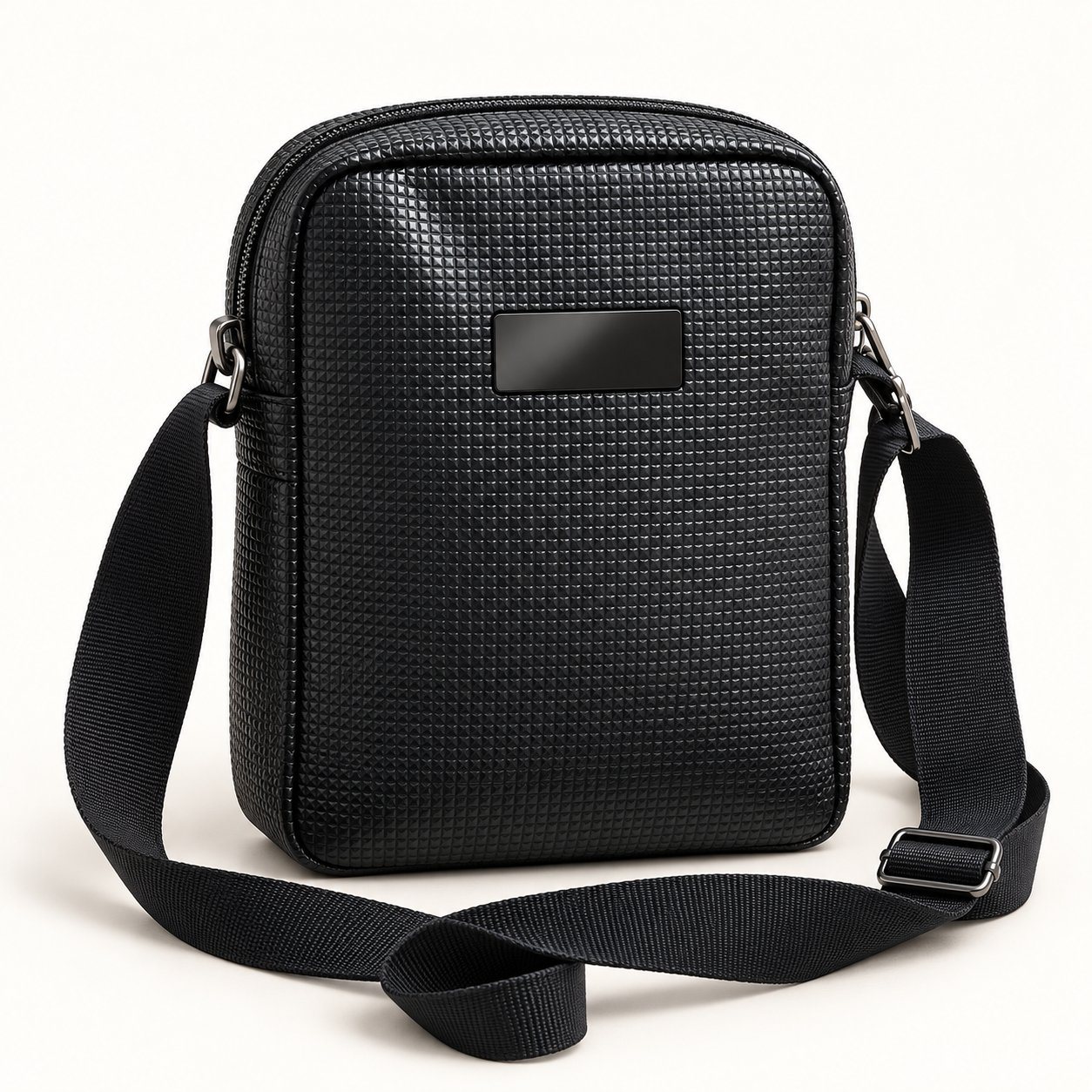 Black embossed micro-grid crossbody sling bag with gunmetal plate
