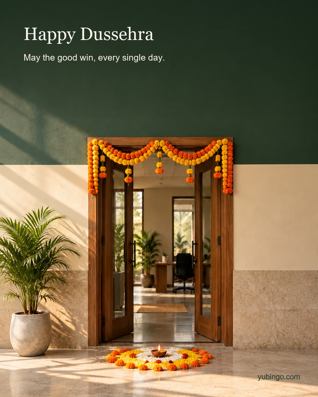 An office entrance with a fresh marigold toran over the door, a small rangoli and a lit diya on the floor in morning light. Text: Happy Dussehra. May the good win, every single day.