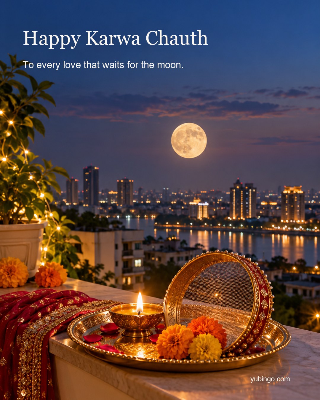A decorated brass thali with a lit diya, a sieve and marigolds on a balcony ledge at moonrise, with a full moon over a city skyline. Text: Happy Karwa Chauth. To every love that waits for the moon.